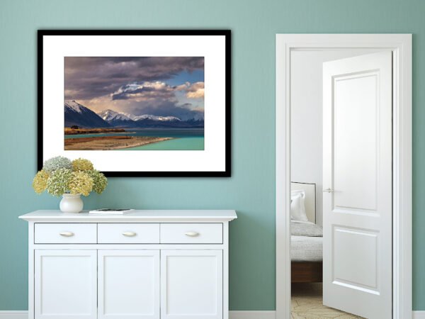 Framed landscape painting in modern room