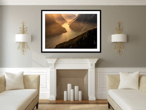 Modern living room with framed landscape painting.