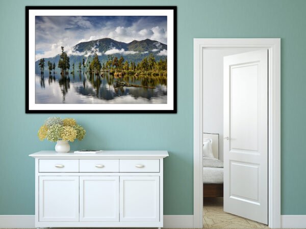 Framed landscape photo in modern interior.