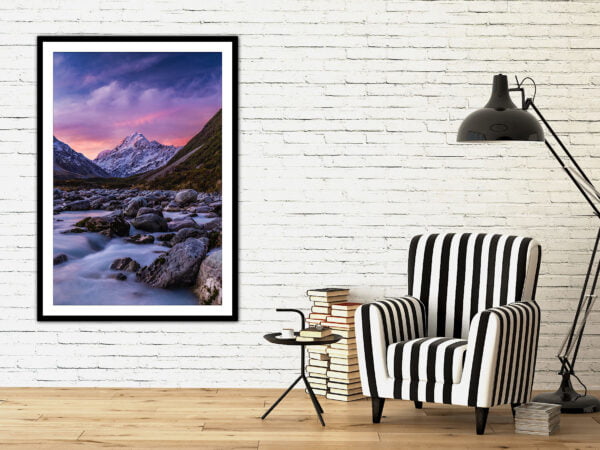 Framed mountain photo, cosy reading nook.