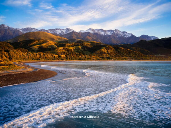 Kaikoura coastline with mountains at sunrise.