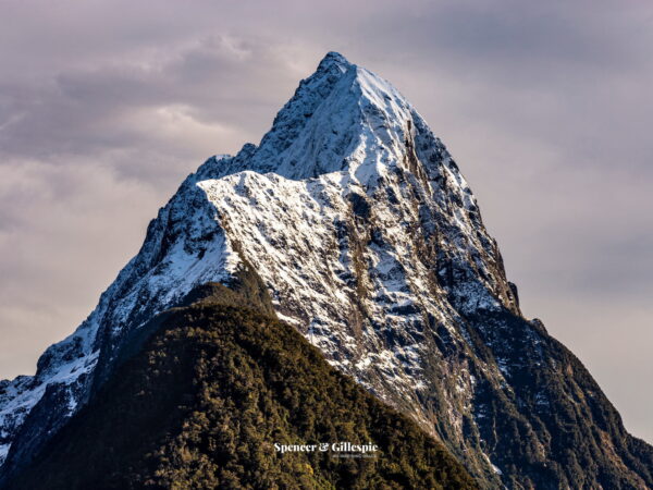 Snow-covered Mitre Peak in Fiordland, New Zealand.