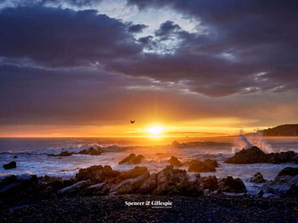 Sunrise over rocky ocean coast