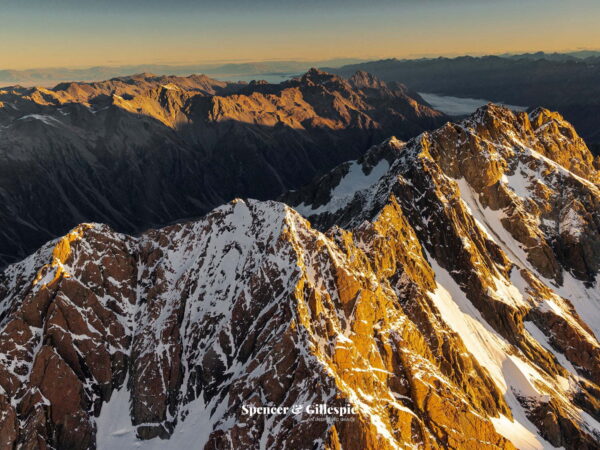 Sunset over snow-capped New Zealand mountain range