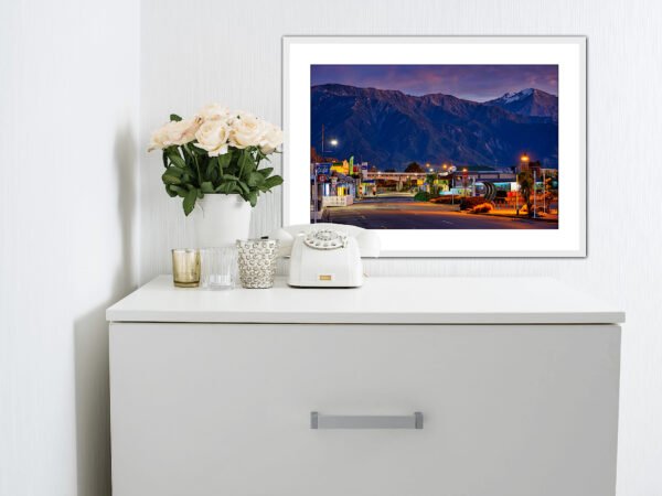 White dresser with flowers and vintage phone