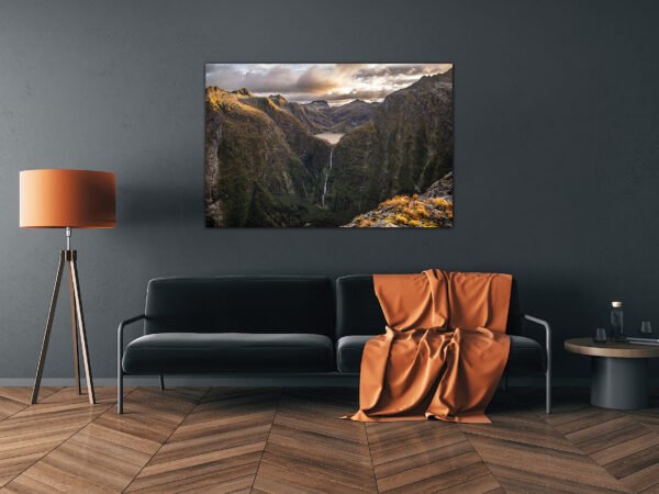 Modern lounge with mountain artwork and orange decor