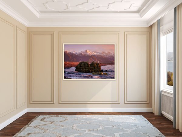 Framed mountain artwork in living room.
