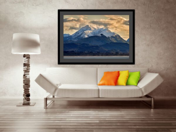 Modern living room with mountain photo artwork.
