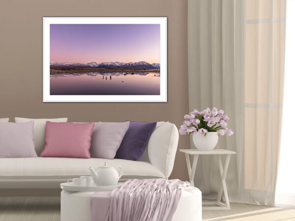 Living room with mountain lake photo.