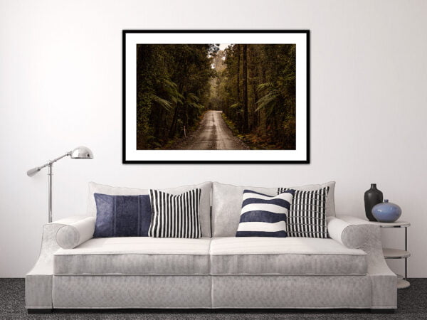 Modern lounge with framed forest road artwork