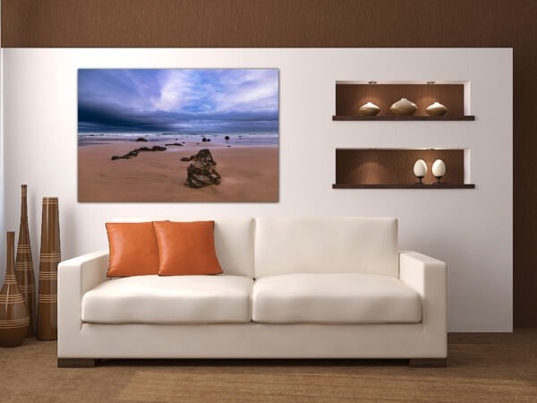 Modern living room with beach artwork.