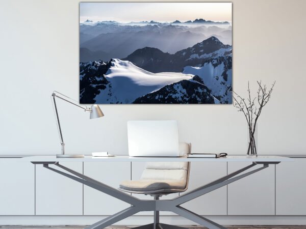 Modern office with mountain landscape art.
