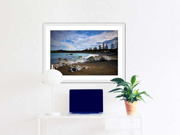 Desk with beach picture on wall