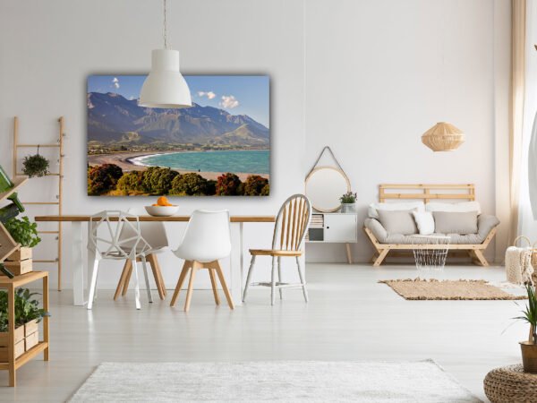 Modern living room with mountain view painting.