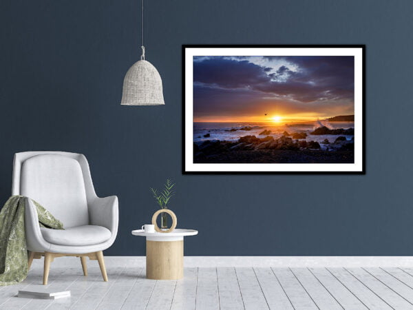 Modern room with coastal sunset artwork