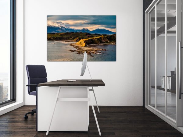 Modern office with coastal landscape artwork.