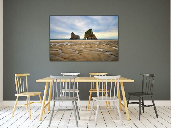 Dining area with landscape artwork on wall.