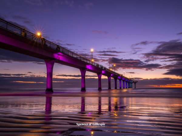 New Brighton Pier illuminated at sunset, Christchurch