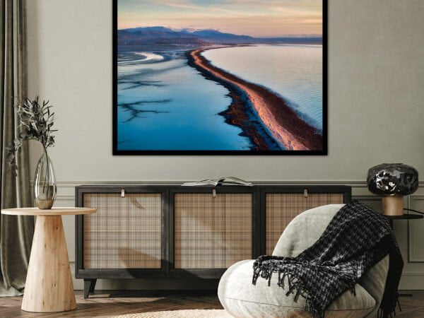 Living room with coastal landscape painting.