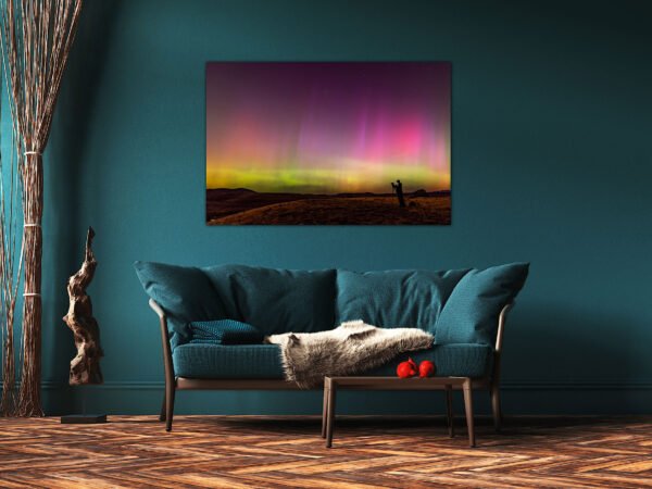Living room with teal sofa and aurora painting.